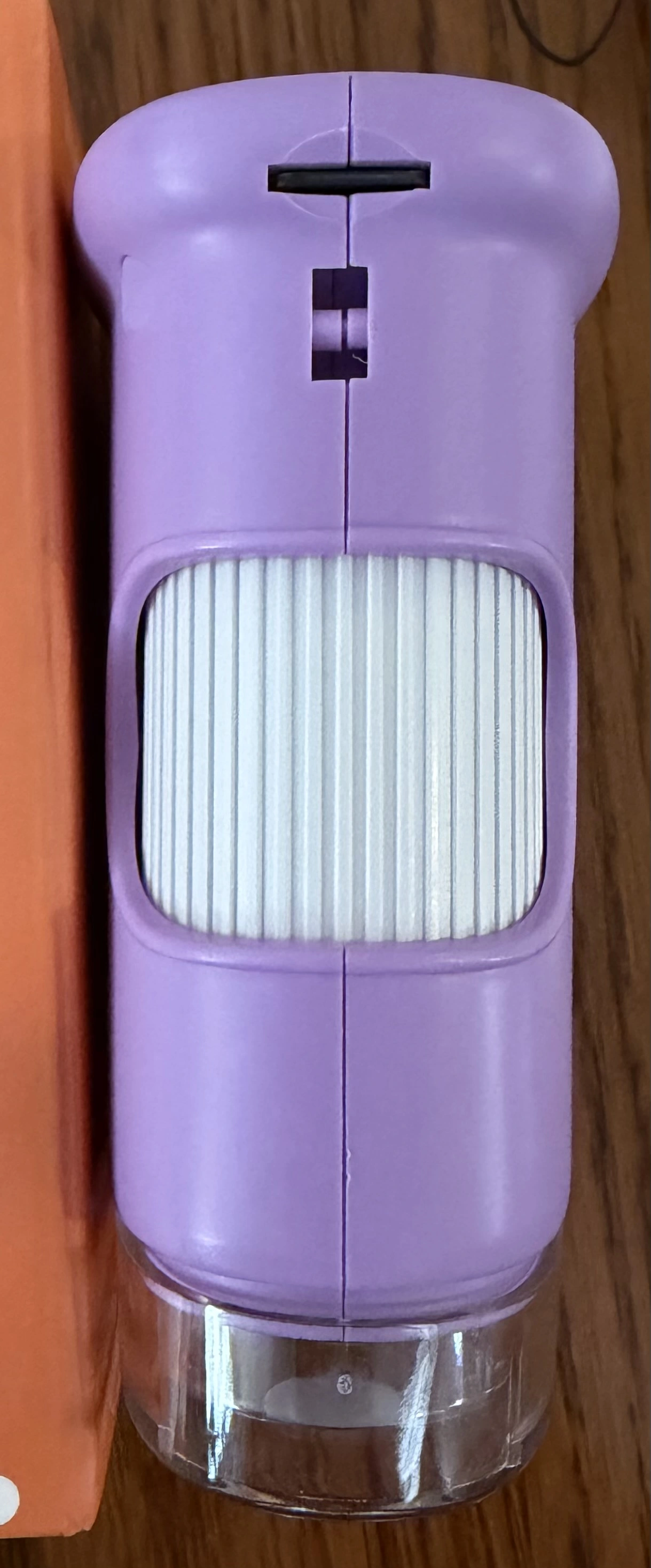 WonderQuest microscope showing the USB-C charging port and microSD card slot on the edge