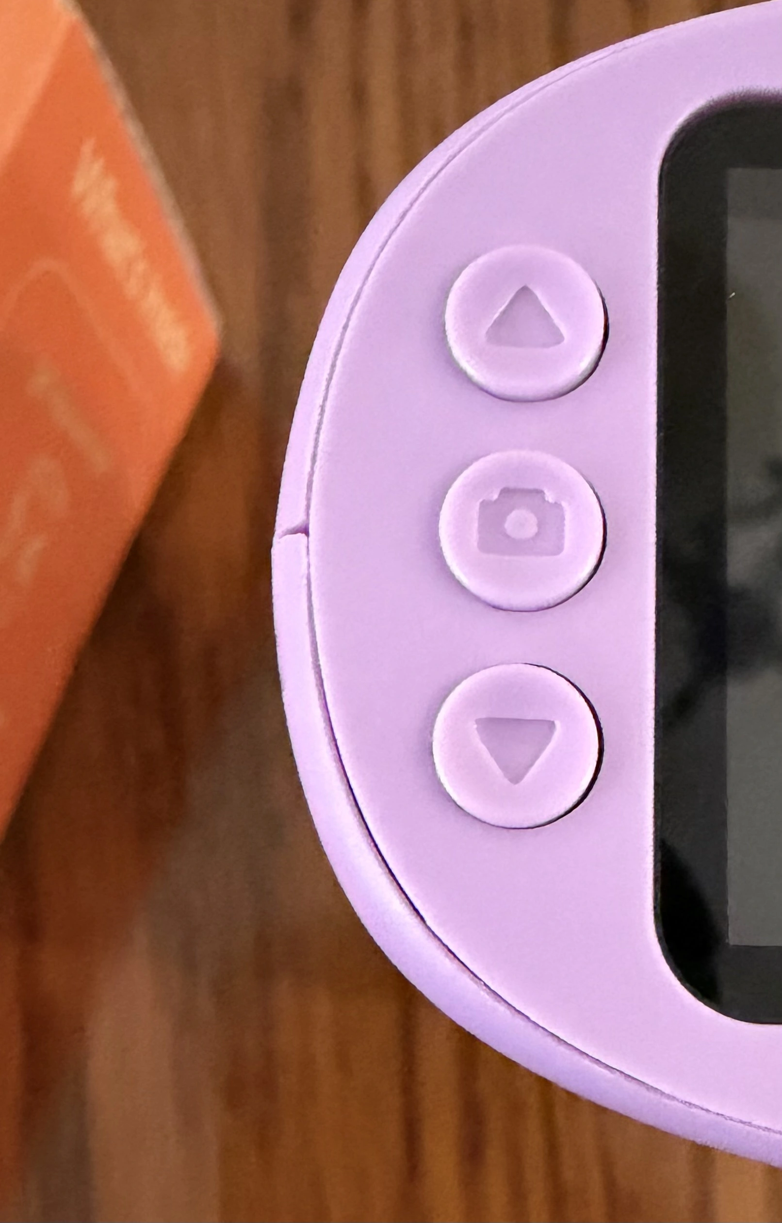 Left-hand buttons on the WonderQuest microscope: zoom in, capture, and zoom out